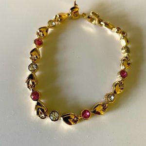 Austrian crystal bracelet with gold hearts and pink and clear crystals.